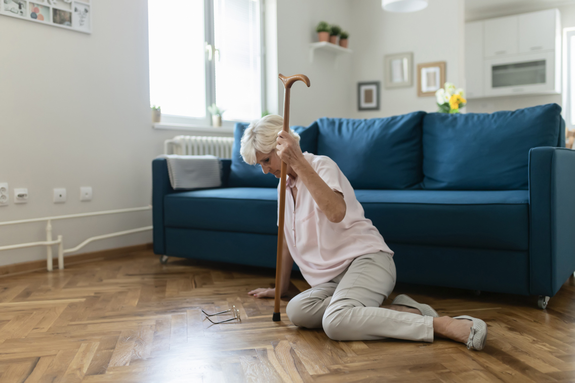 Older woman sitting on the floor