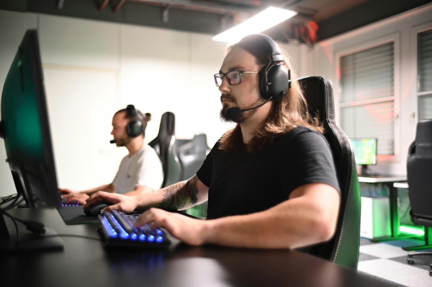 Two boys gaming in a room