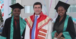Professor Adnan Kisa pictured at graduation with two of his students.