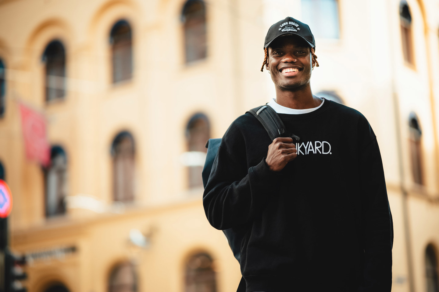 Student in front of campus building.