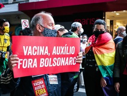 A man holds a sign during a protest 