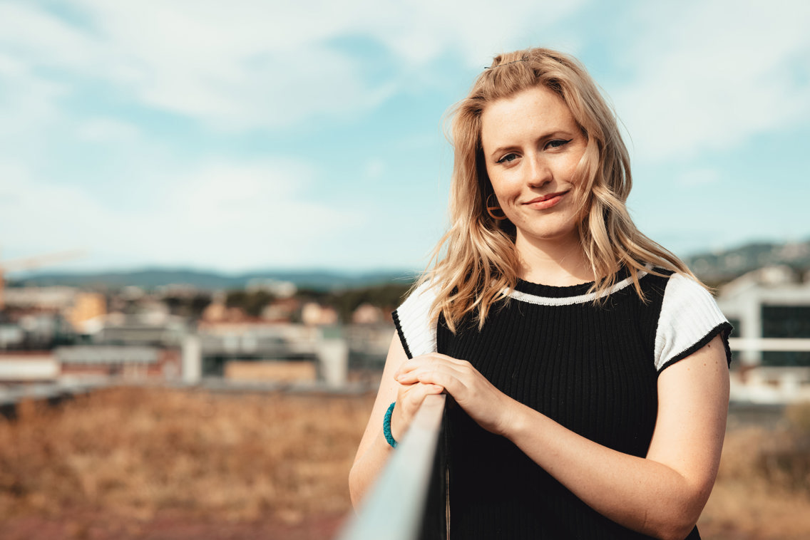 Woman on a rooftop.