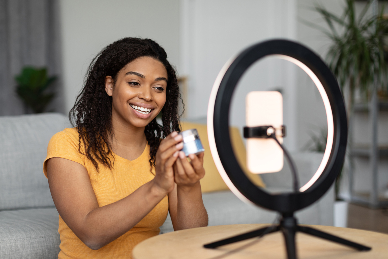 Woman with cream in front of camera 